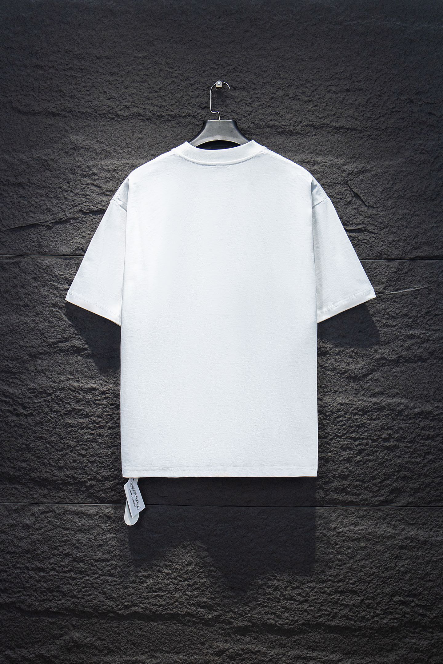 White short-sleeve T-shirt, back view, with small hang tag