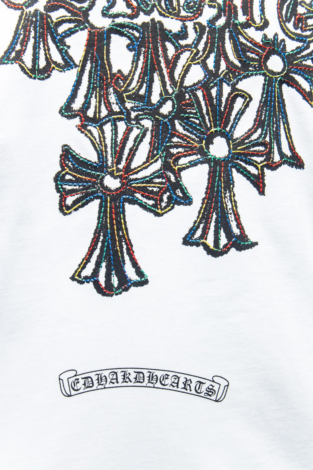 White T-shirt close-up of large multicolor floral graphic with decorative border