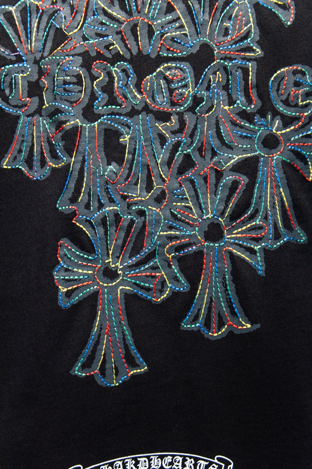 Black T-shirt with large blue and teal floral graphic embroidery