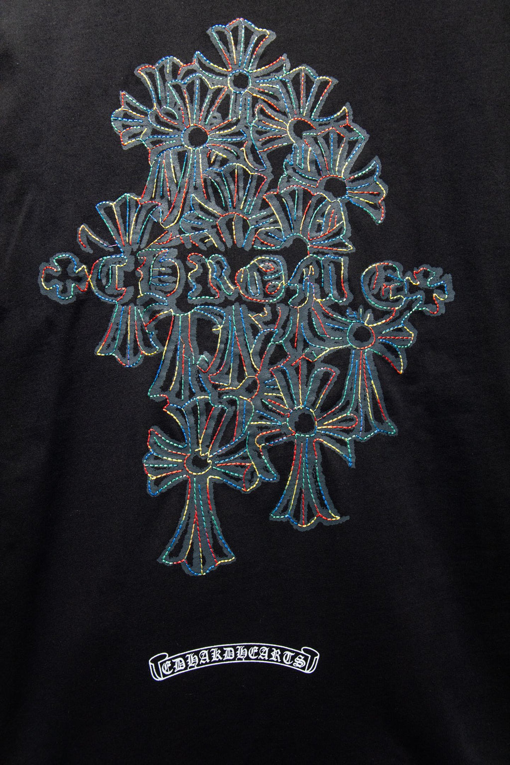 Black T-shirt with large multi-flower emblem embroidery and small label