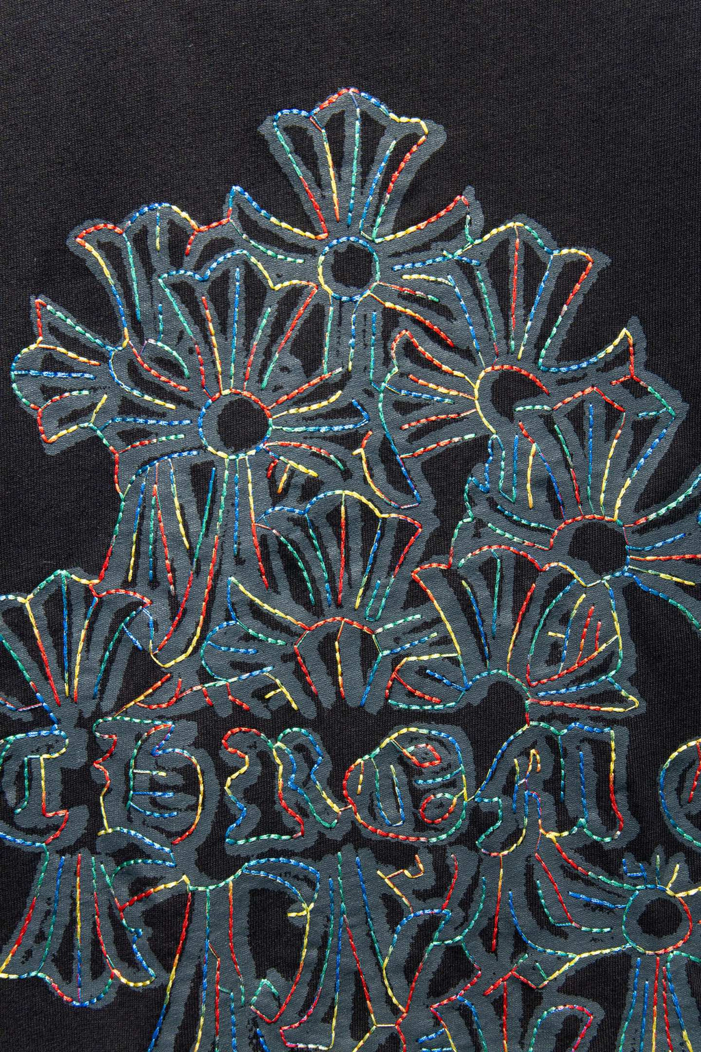 Black T-shirt close-up of large floral graphic embroidery
