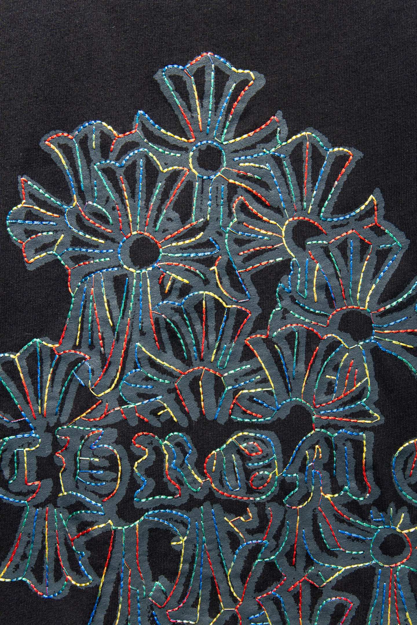 Black T-shirt close-up of large floral graphic embroidery