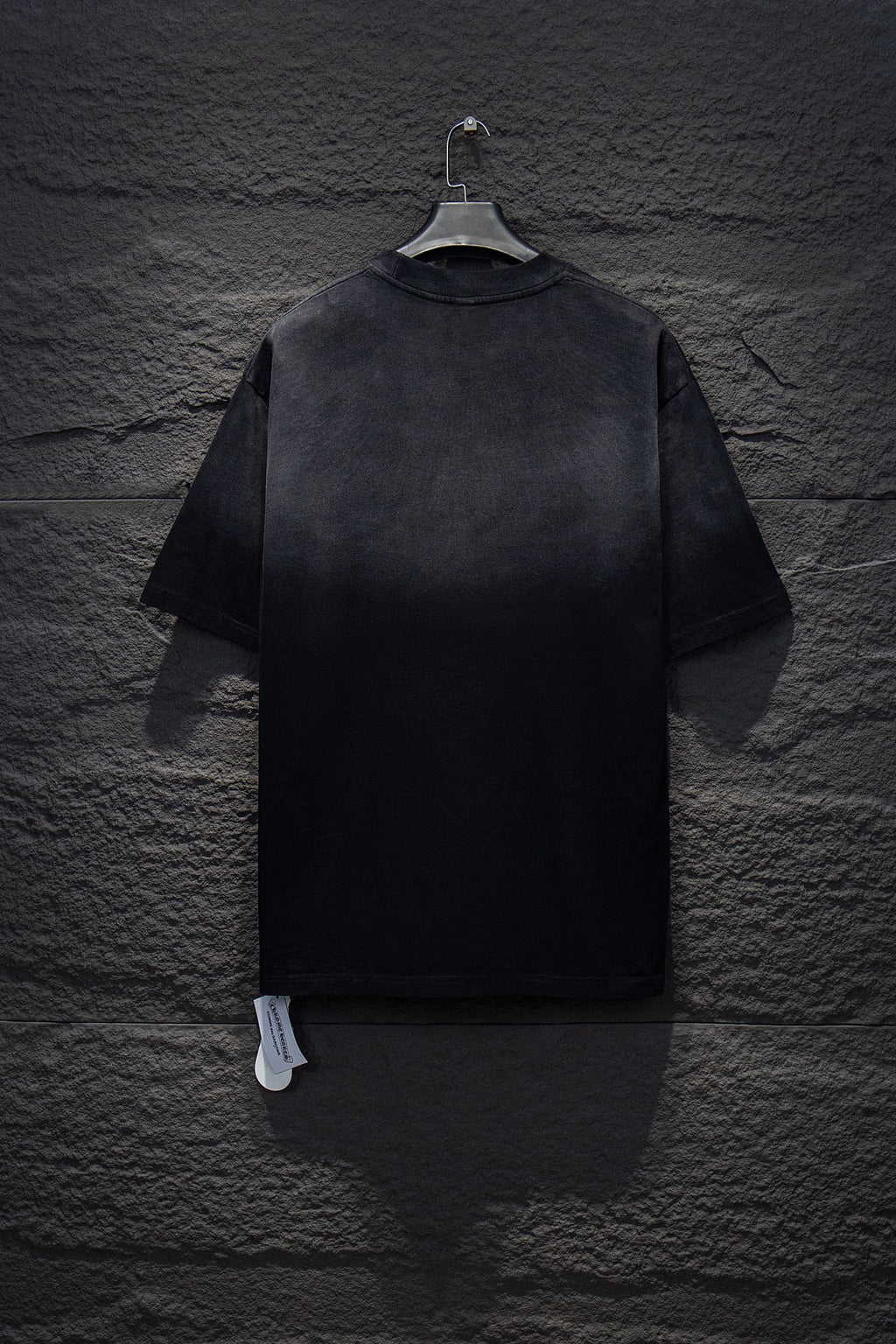 Chrome short-sleeve top, black knit with small stud accents on back