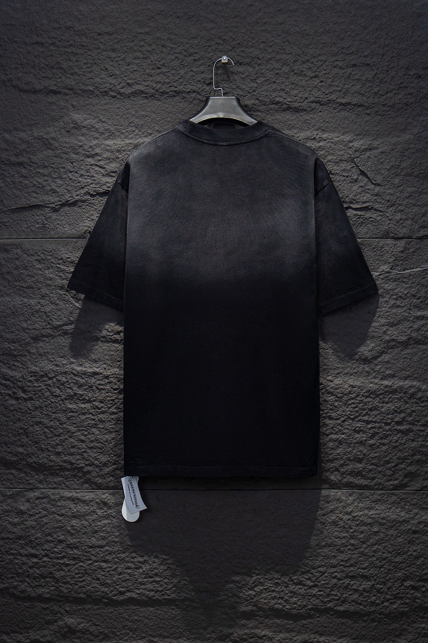 Chrome short-sleeve top, black knit with small stud accents on back