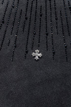 Chrome short-sleeve top, black knit with small cross emblem pin