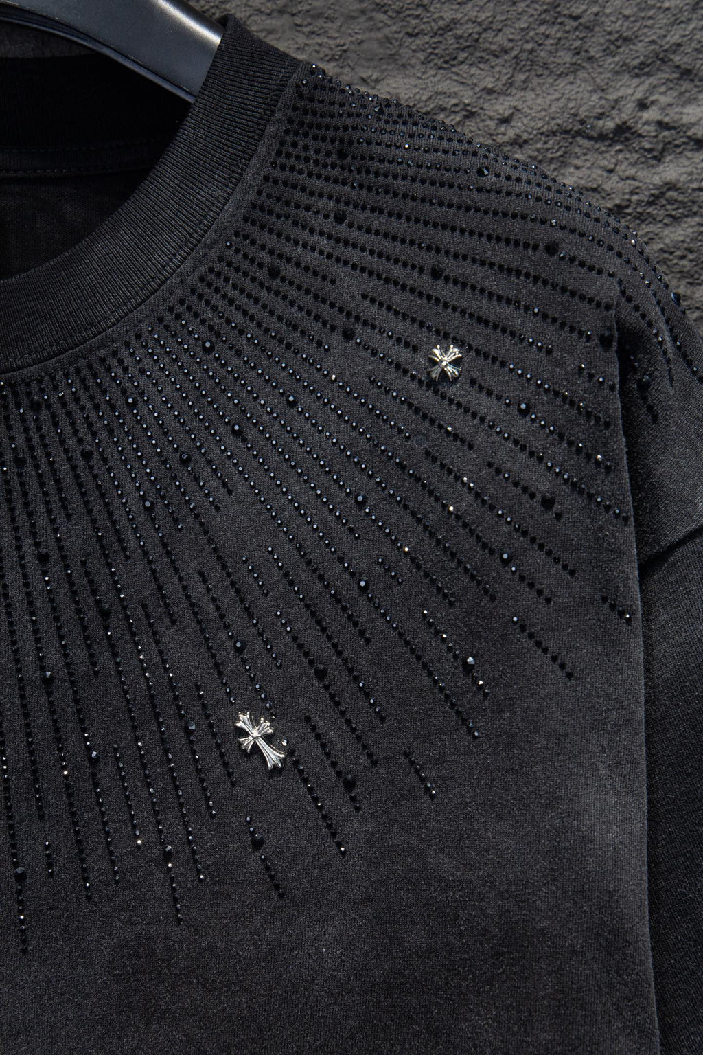 Chrome short-sleeve top, black knit with studded diagonal drip design