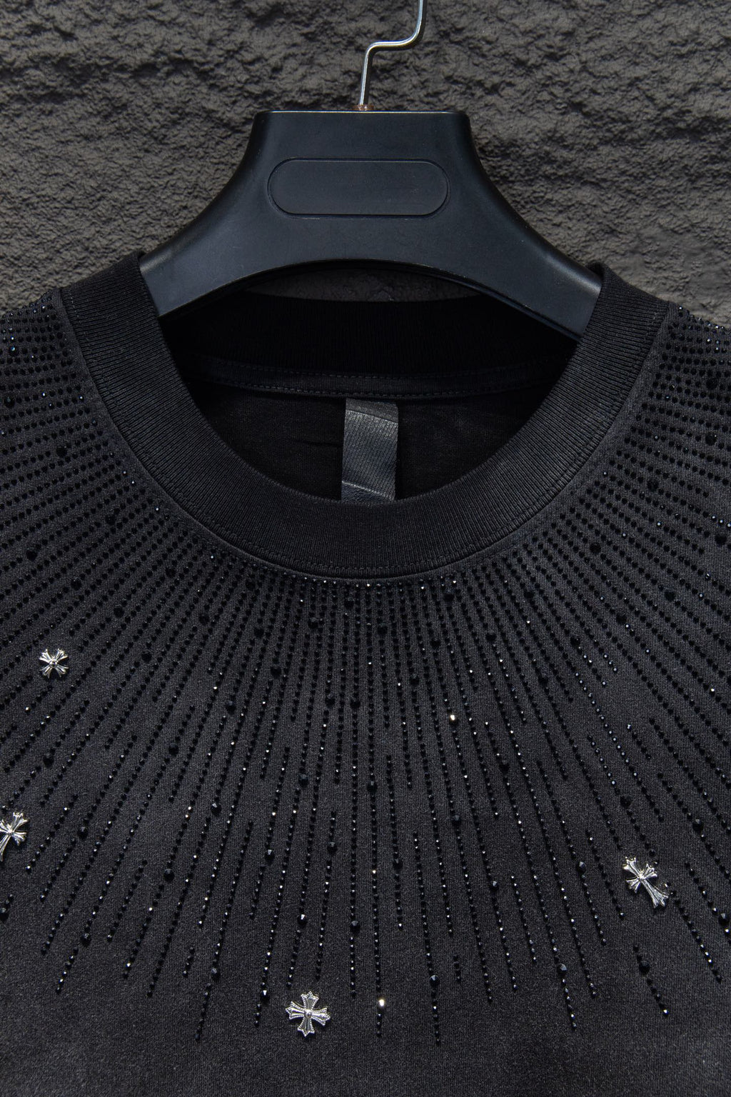 Chrome short-sleeve top neckline, black knit with studded drip pattern