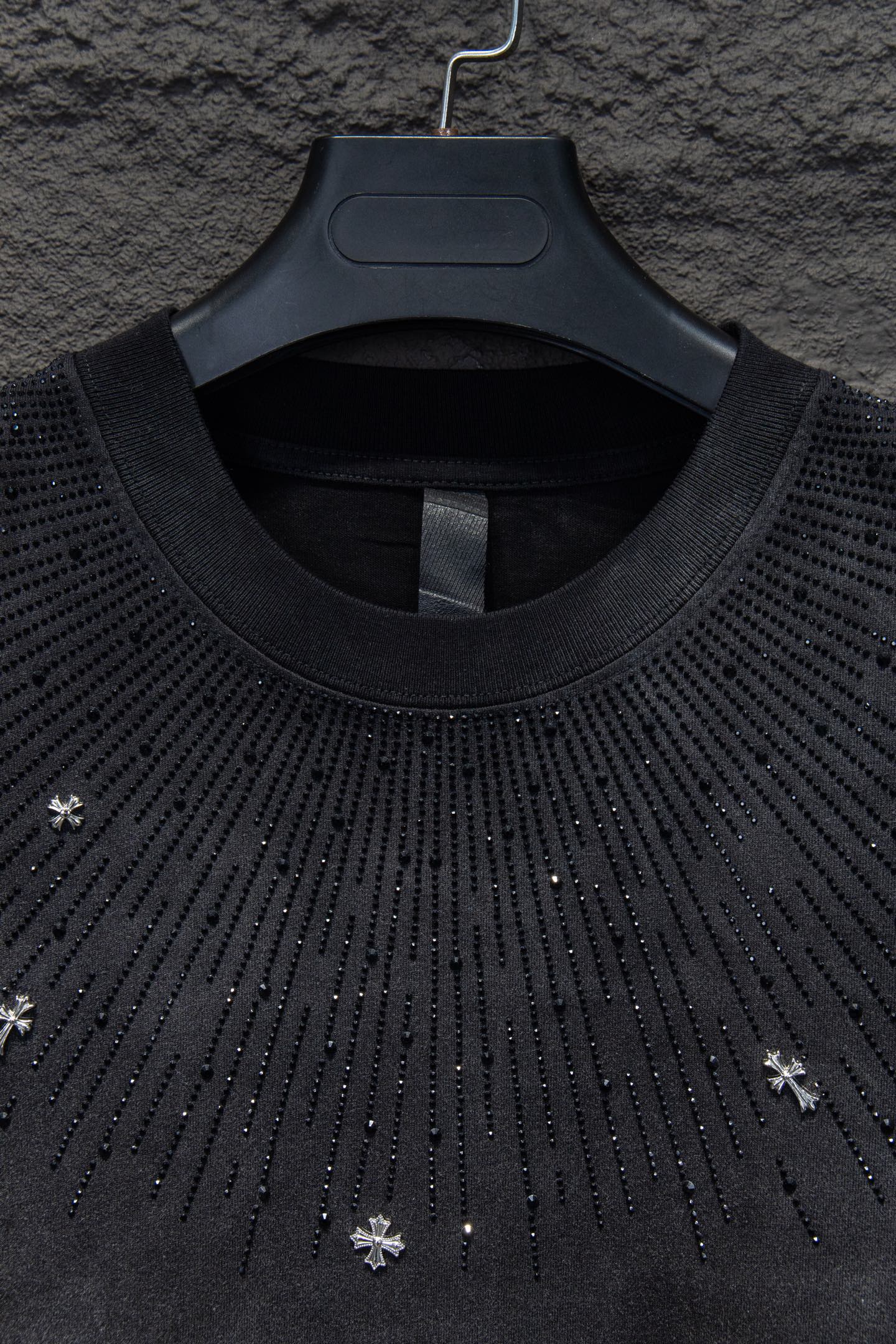 Chrome short-sleeve top neckline, black knit with studded drip pattern
