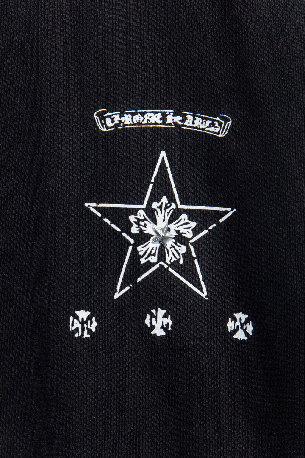 Black T-shirt with large star and crosshair graphic with smaller icons