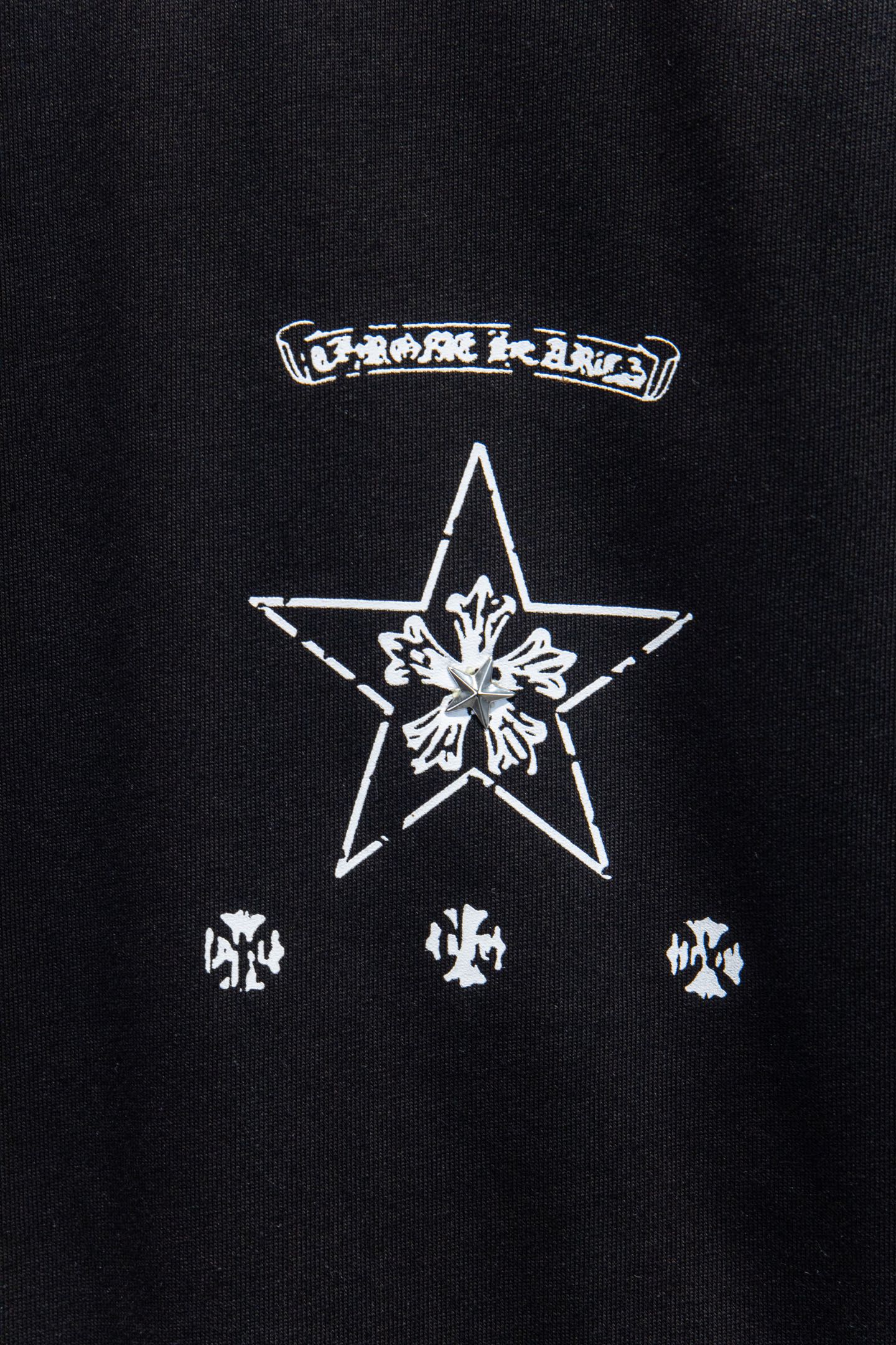 Black T-shirt with large star and crosshair graphic with smaller icons
