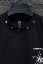 Black T-shirt neckline with star embroidery and partial graphic at chest
