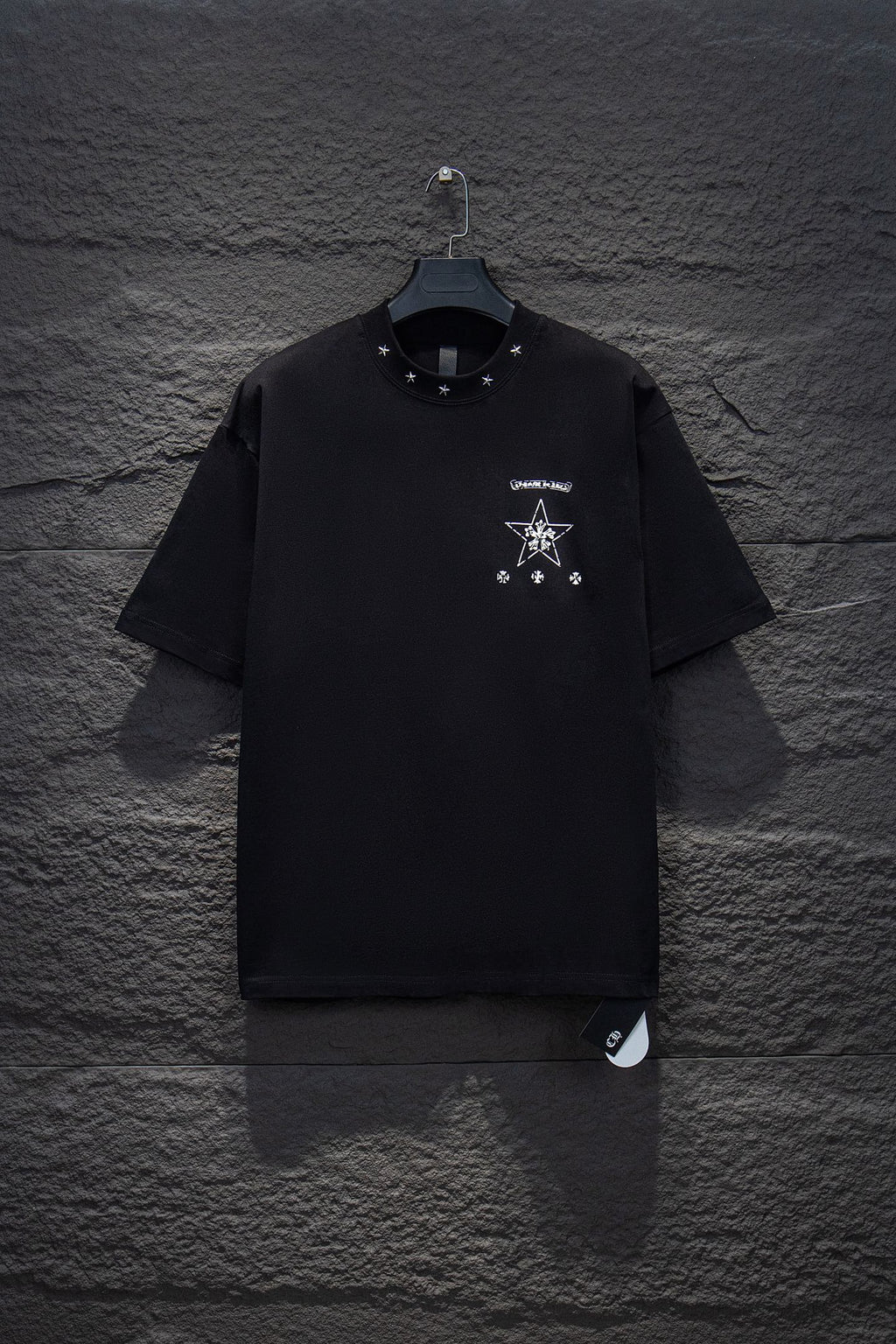 Black short-sleeve T-shirt with small chest star and logo graphic