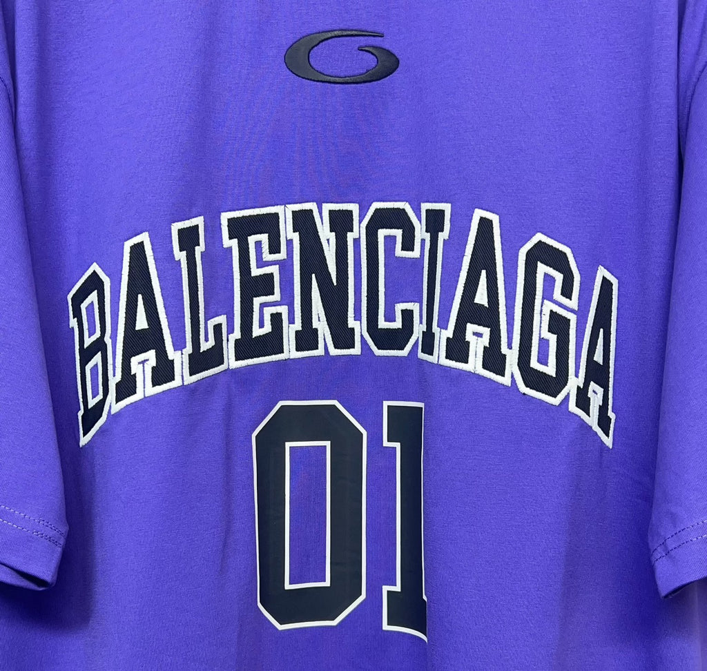 Purple T-shirt close-up of BALENCIAGA lettering and '01' number