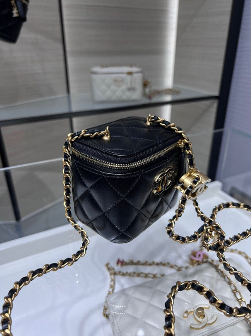 Chanel quilted leather mini bag with gold chain strap and zip closure, black
