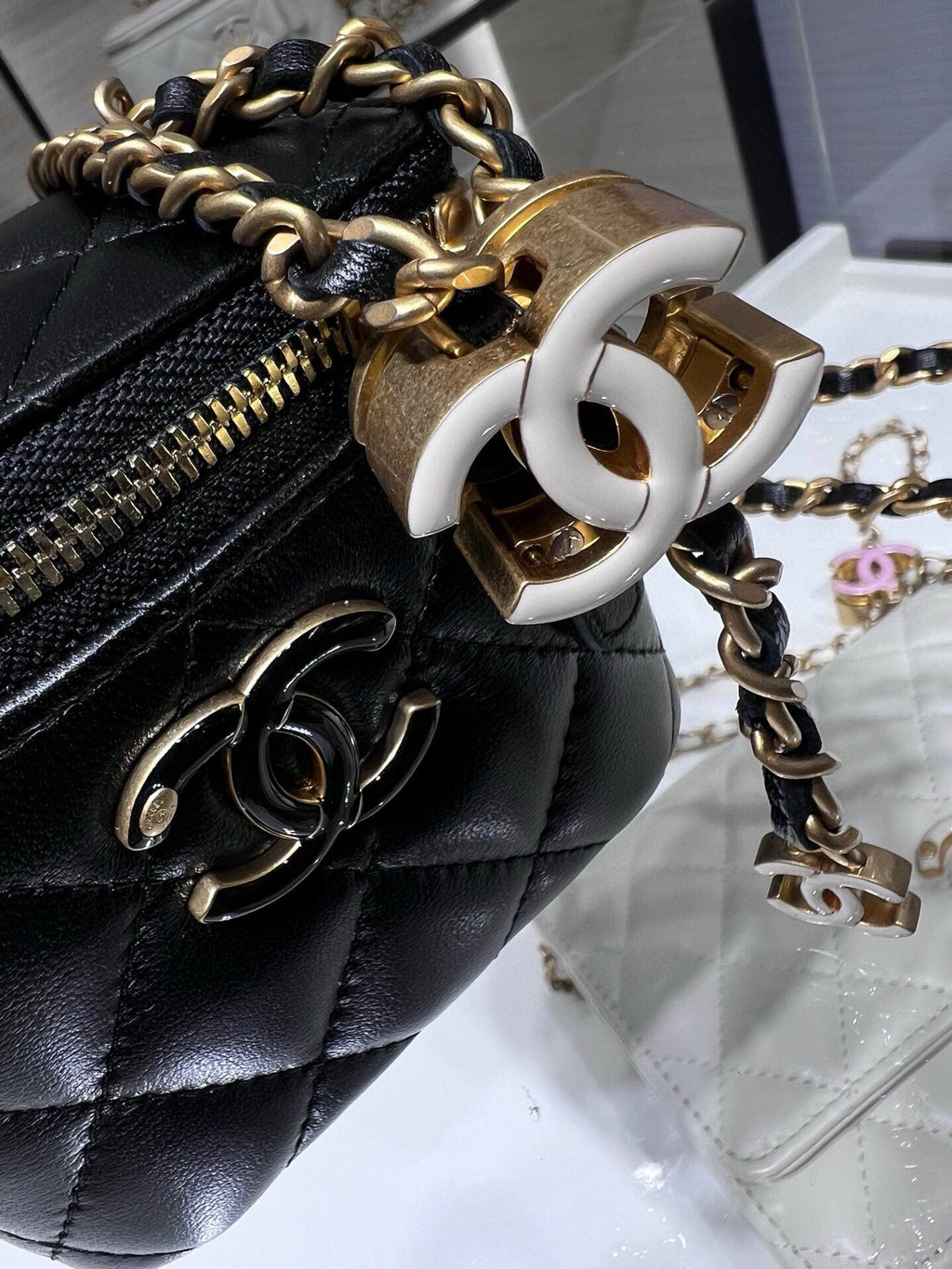 Chanel quilted leather mini bag with gold chain strap and large CC turn-lock clasp, black
