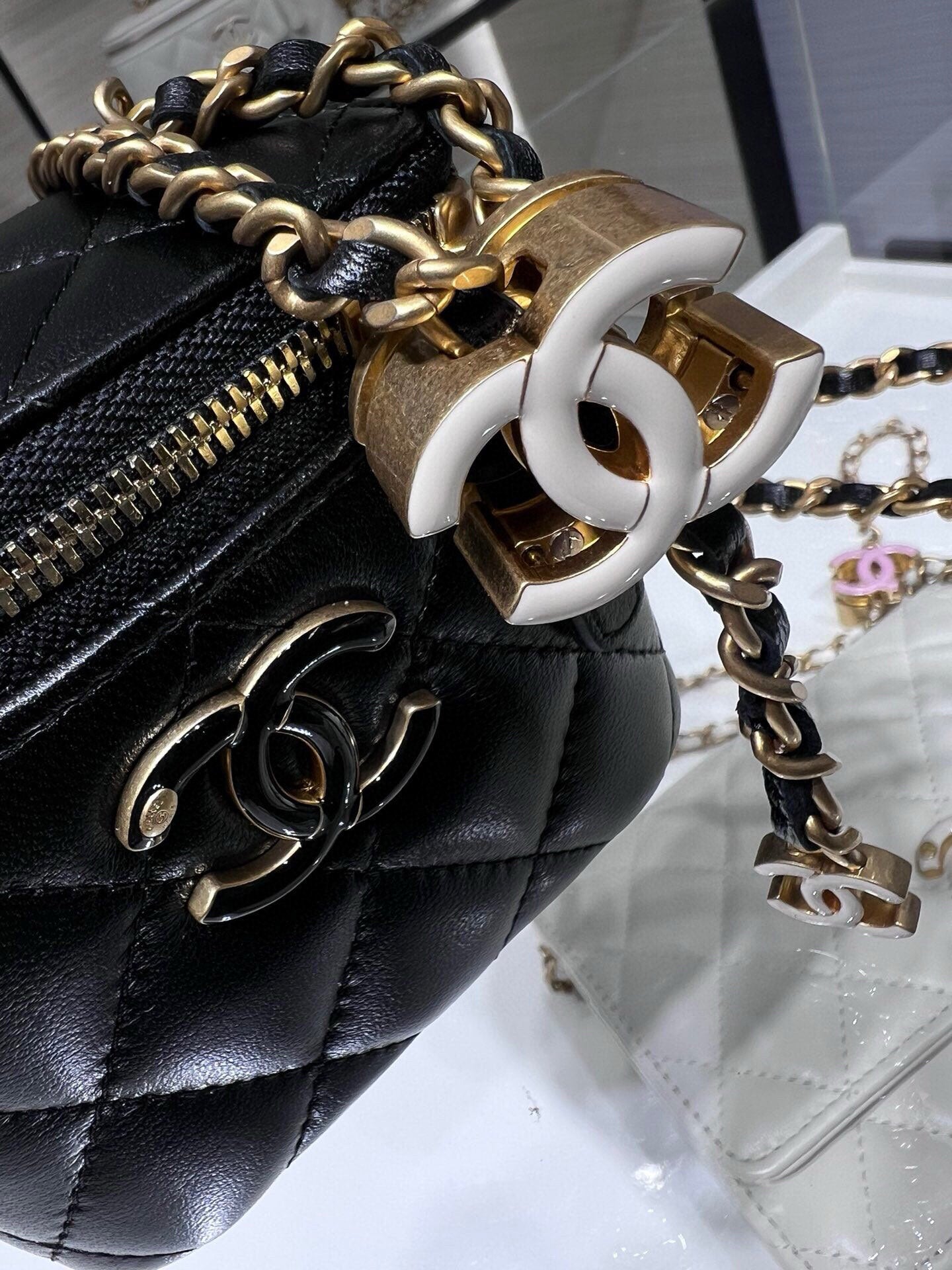 Chanel quilted leather mini bag with gold chain strap and large CC turn-lock clasp, black