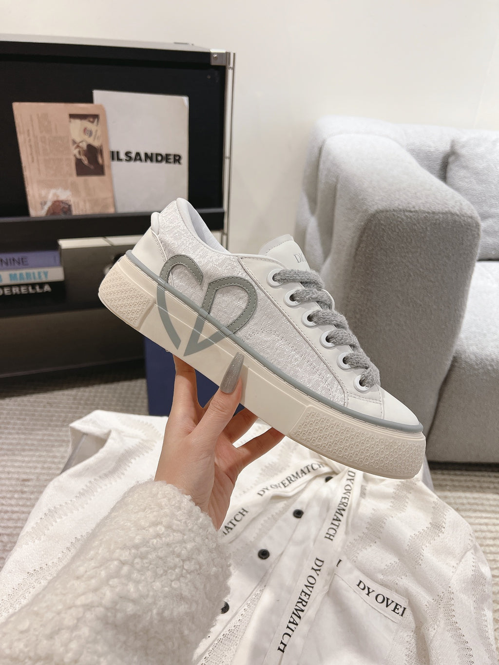 Low-top Dior sneakers, white uppers with gray laces and large gray V logo detail