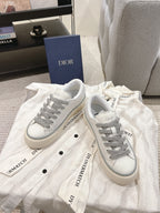 Low-top Dior sneakers, white with gray laces, side logo and strap overlay