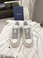 Low-top Dior sneakers, white uppers with gray laces and side logo patch