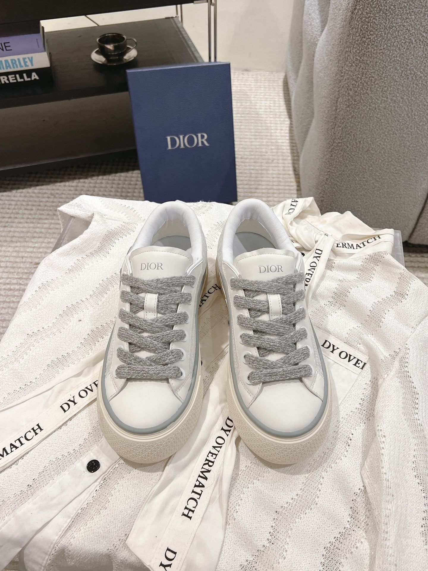 Low-top Dior sneakers, white uppers with gray laces and side logo patch