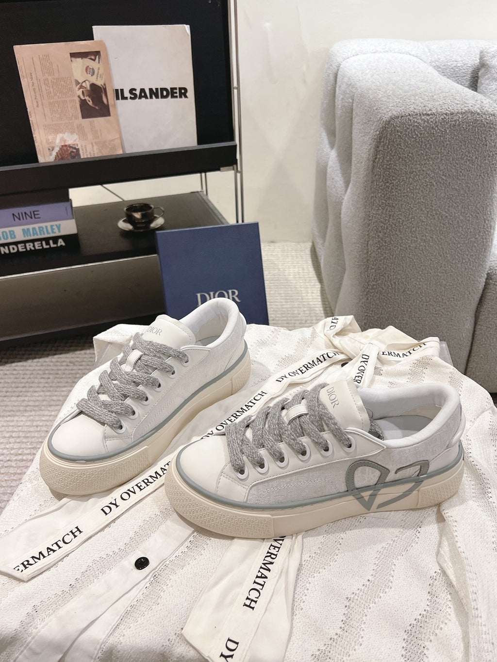 Low-top Dior sneakers, white with gray laces and translucent gray trim at sides