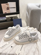 Low-top Dior sneakers, white with gray laces and translucent gray trim at sides