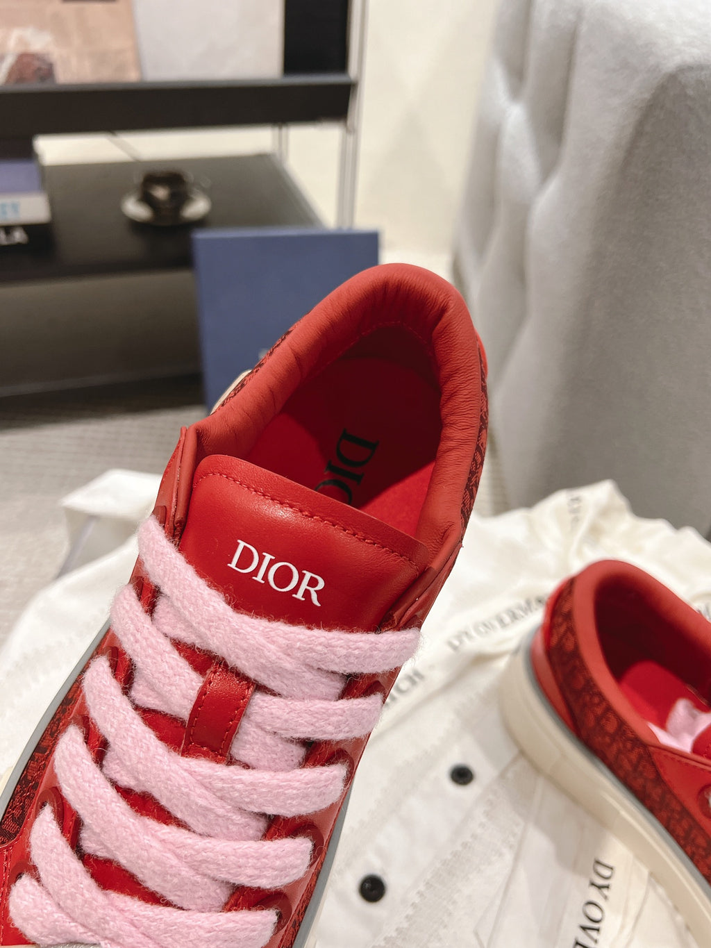 Red Dior sneaker close-up of heel and tongue with Dior branding