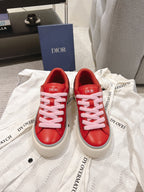 Red Dior low-top sneakers with pink laces and side logo detail