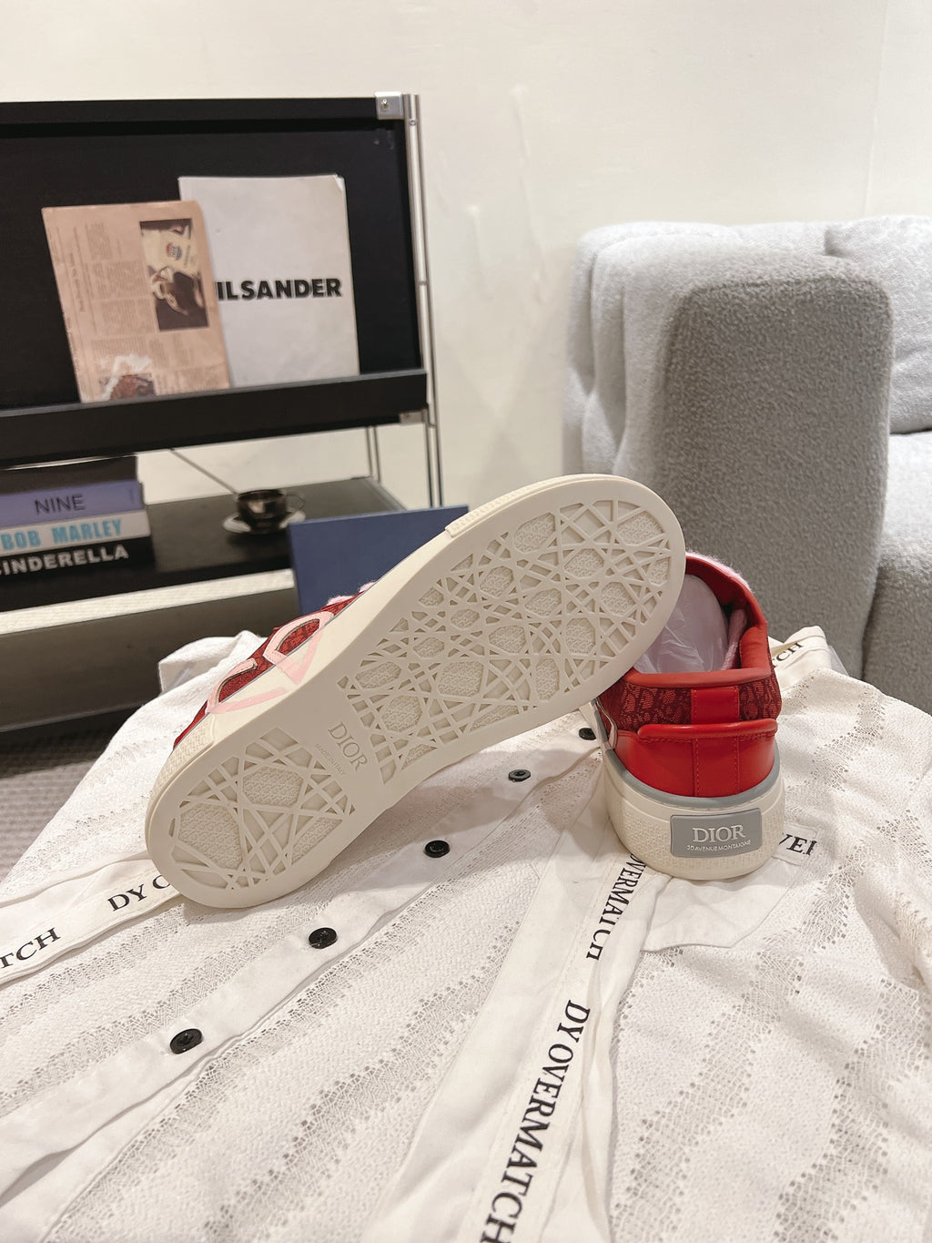 White rubber outsole of red Dior low-top sneaker with tread pattern