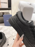 Dior unisex dark gray low-top sneakers with textured panels and lace-up detail