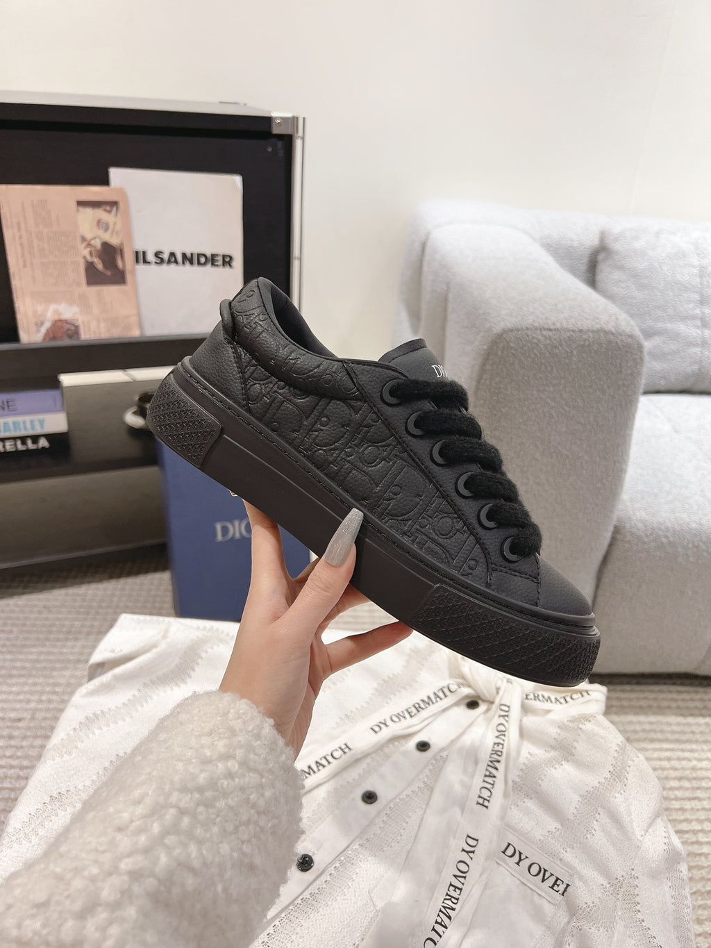 Dior unisex dark gray lace-up sneakers with embossed texture and lace eyelets