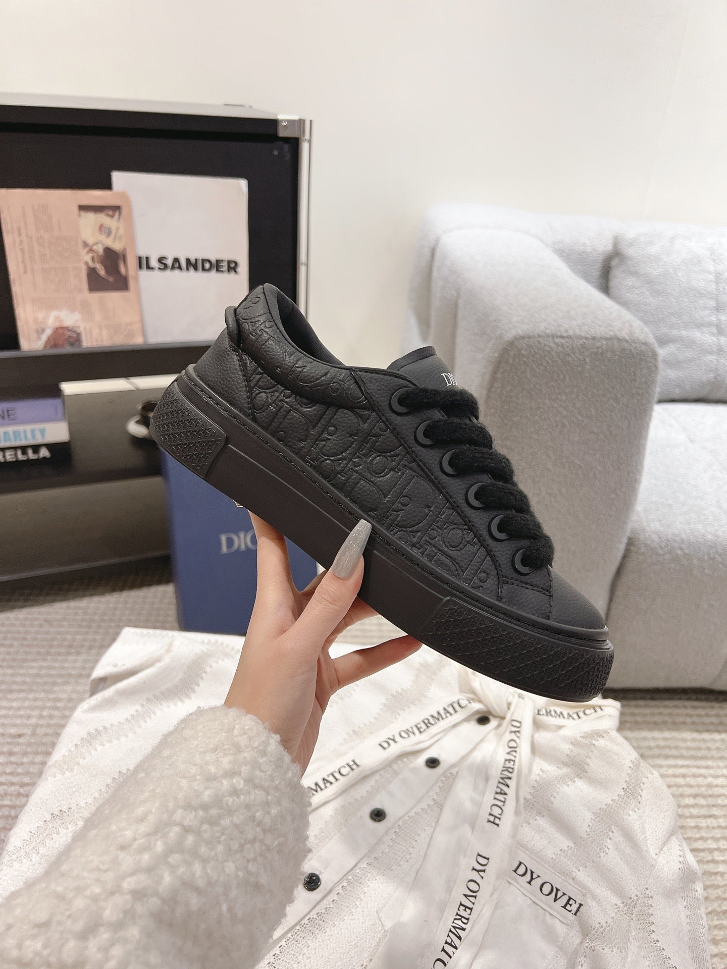 Dior unisex dark gray lace-up sneakers with embossed texture and lace eyelets