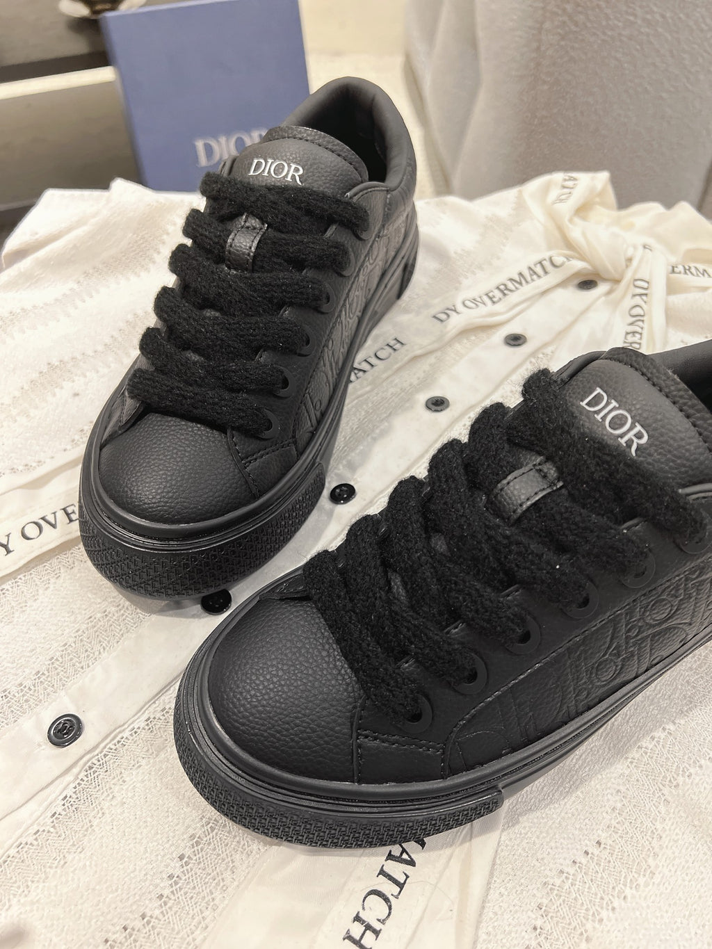 Dior unisex black lace-up sneakers with Dior logo on tongue and textured upper