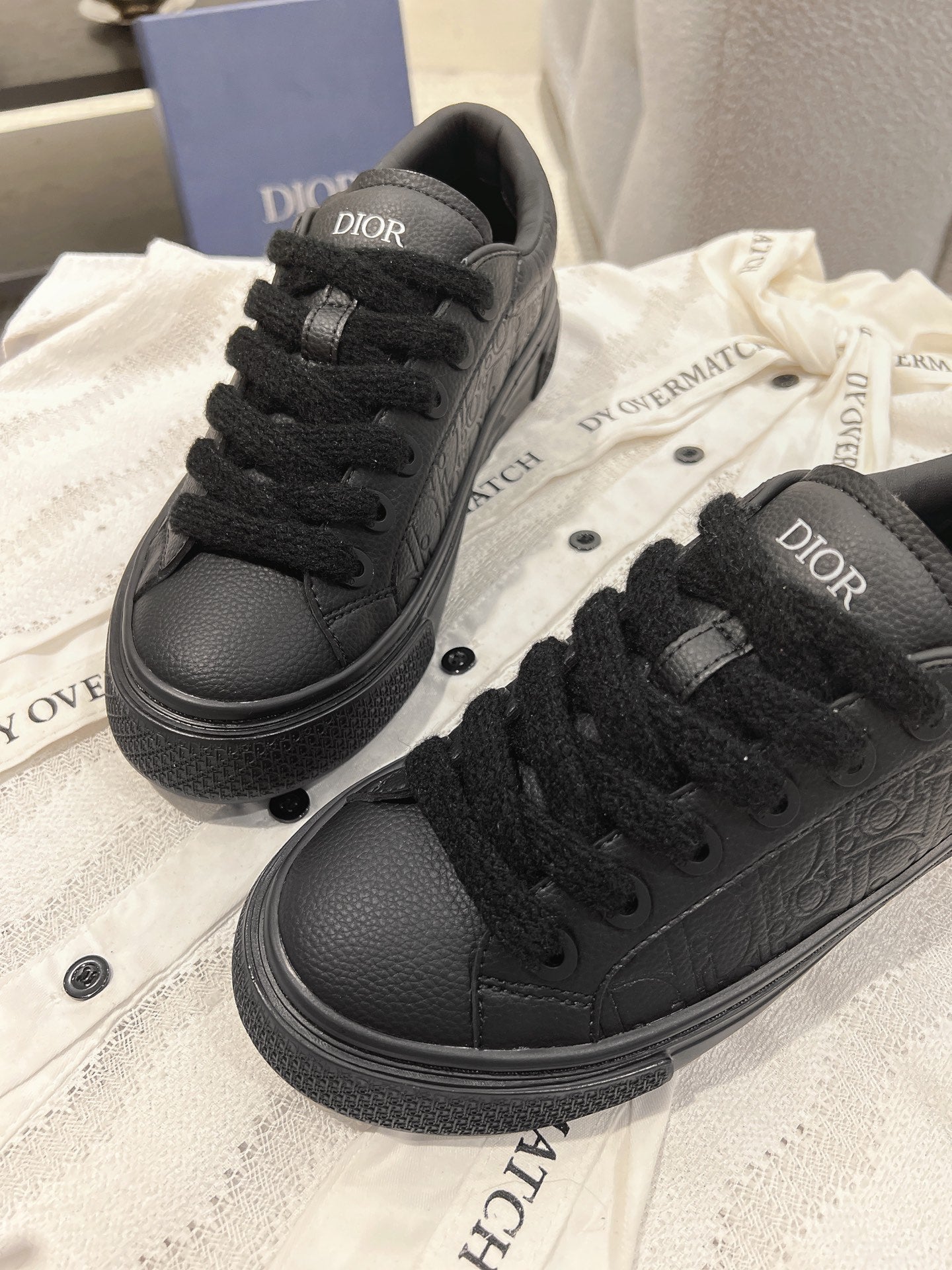 Dior unisex black lace-up sneakers with Dior logo on tongue and textured upper