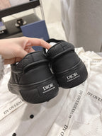 Dior unisex black sneakers with Dior logo on heel and back tab detail