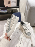 Light gray low-top sneakers with Dior monogram side and white lace-up