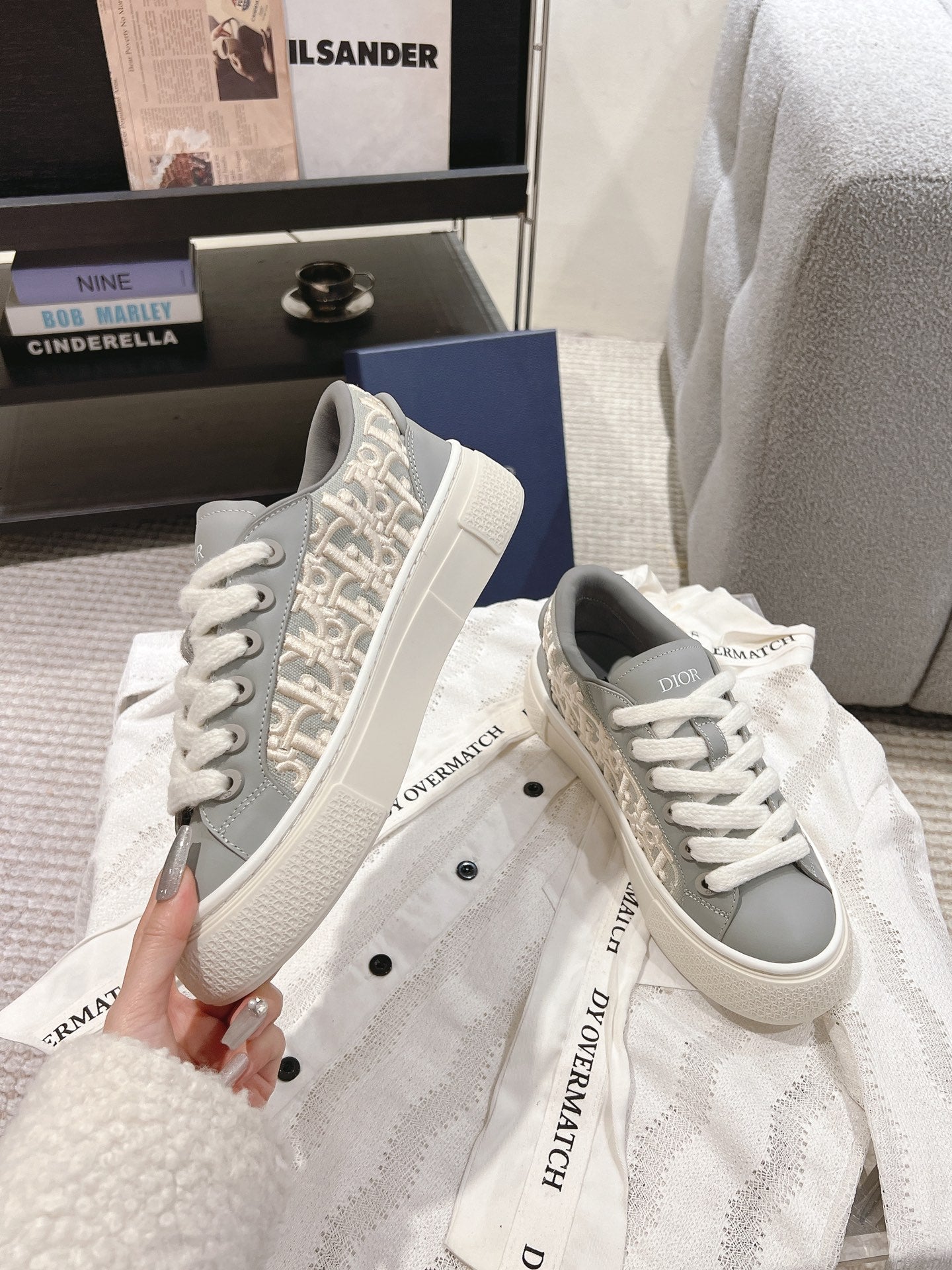 Light gray low-top sneakers with Dior monogram side and white lace-up