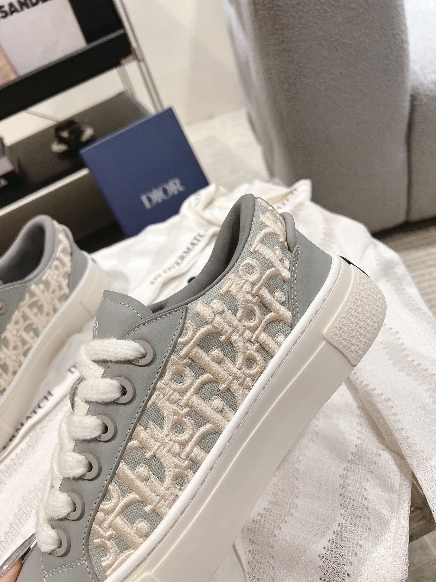 Beige and gray Dior monogram low-top sneakers with white laces and side panel
