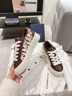 Dior unisex sneakers, dark brown leather, white laces, white midsole, embroidered details