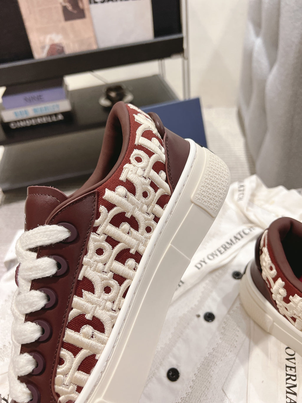 Dior unisex sneakers, red-brown panels with white patterned overlay, white laces