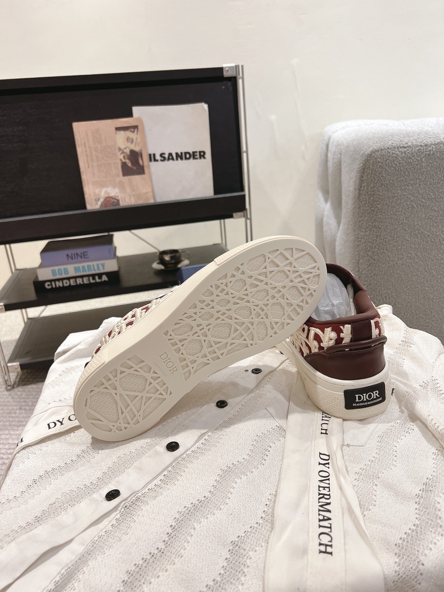 Dior unisex sneakers outsole view, patterned tread on white rubber sole
