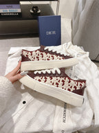 Dior unisex sneakers with burgundy-and-cream logo pattern, white laces, white sole