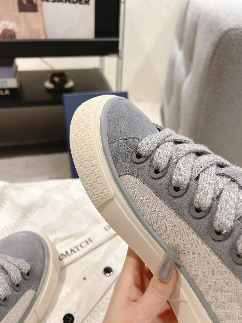 Gray Dior unisex sneaker sole and side detail, lace-up with off-white edge