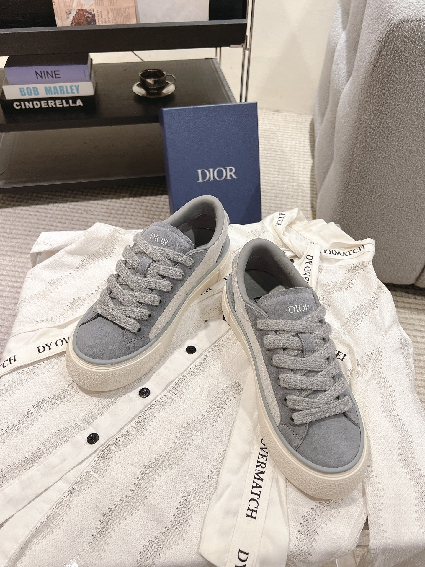 Gray Dior unisex lace-up sneakers with Dior label on tongue, front view