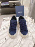 Navy and blue Dior lace-up sneakers with white rubber sole