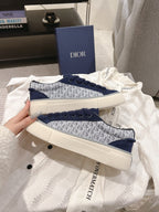 Blue Dior logo sneakers with lace-up front and white textured sole