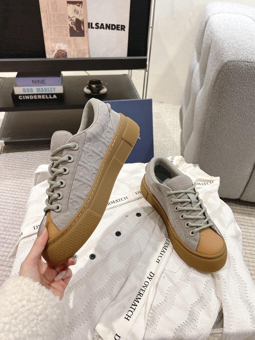 Dior unisex sneakers, light gray leather with tan sole, lace-up front view