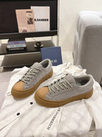 Dior unisex sneakers, light gray uppers with tan sole, gray laces and stitching