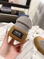 Dior unisex sneaker heel detail, gray upper with tan rubber sole and Dior logo