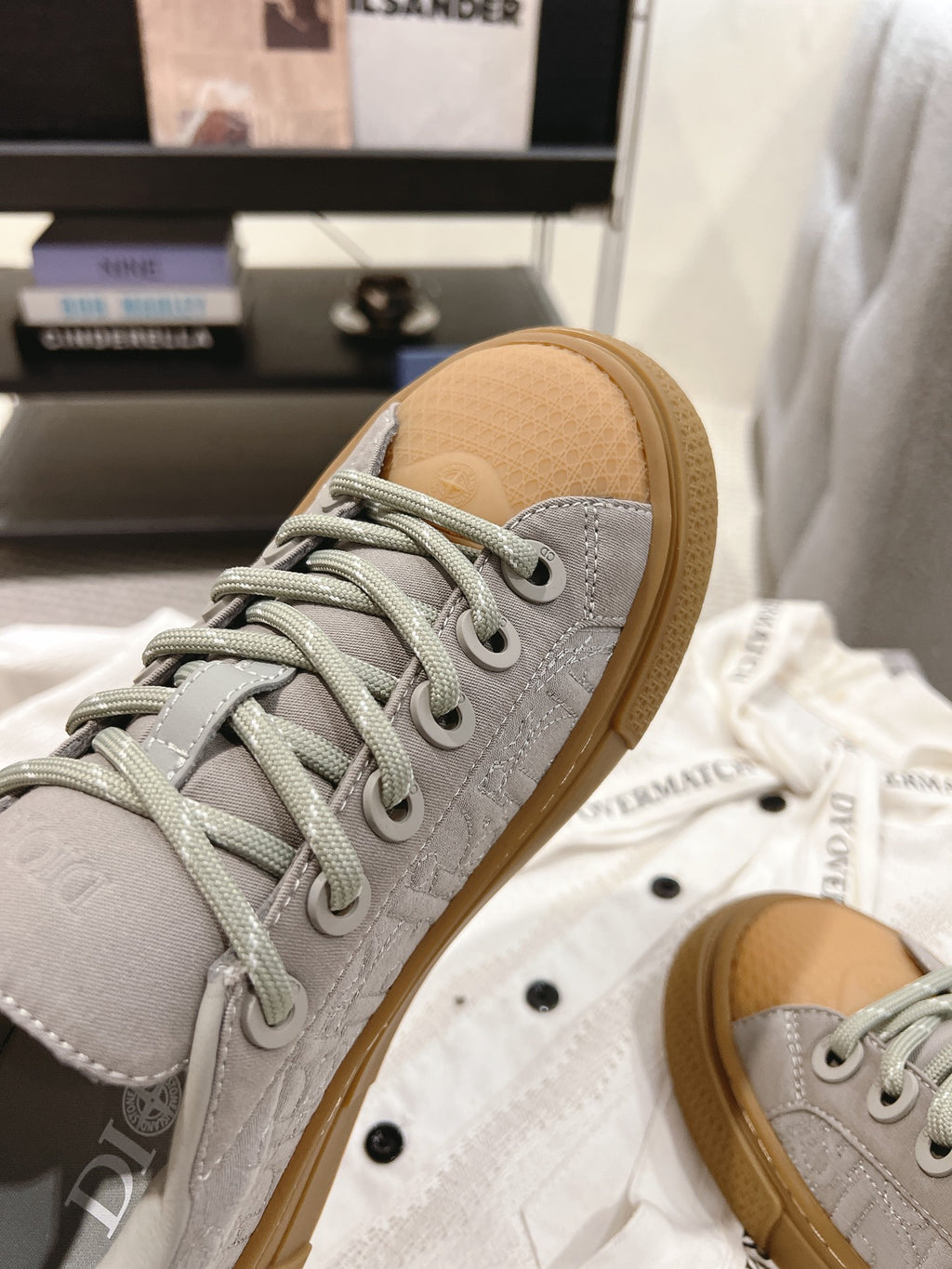 Dior unisex sneaker toe, light gray textured upper with tan rubber sole